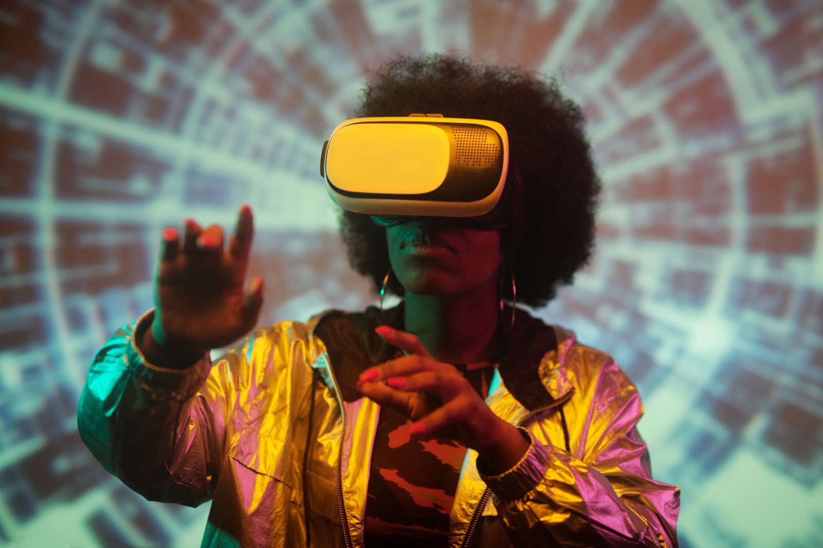 Founder in a NODE Miami startup cohort testing an immersive VR headset while building emerging technology in the coworking studio